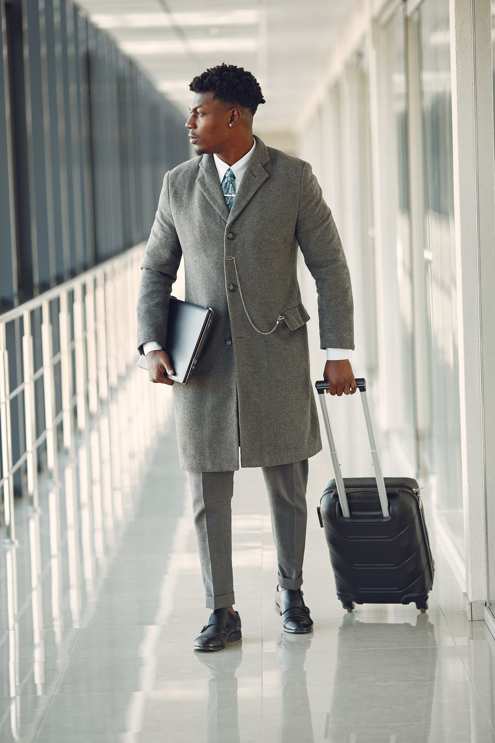 Business traveller walking through a modern airport